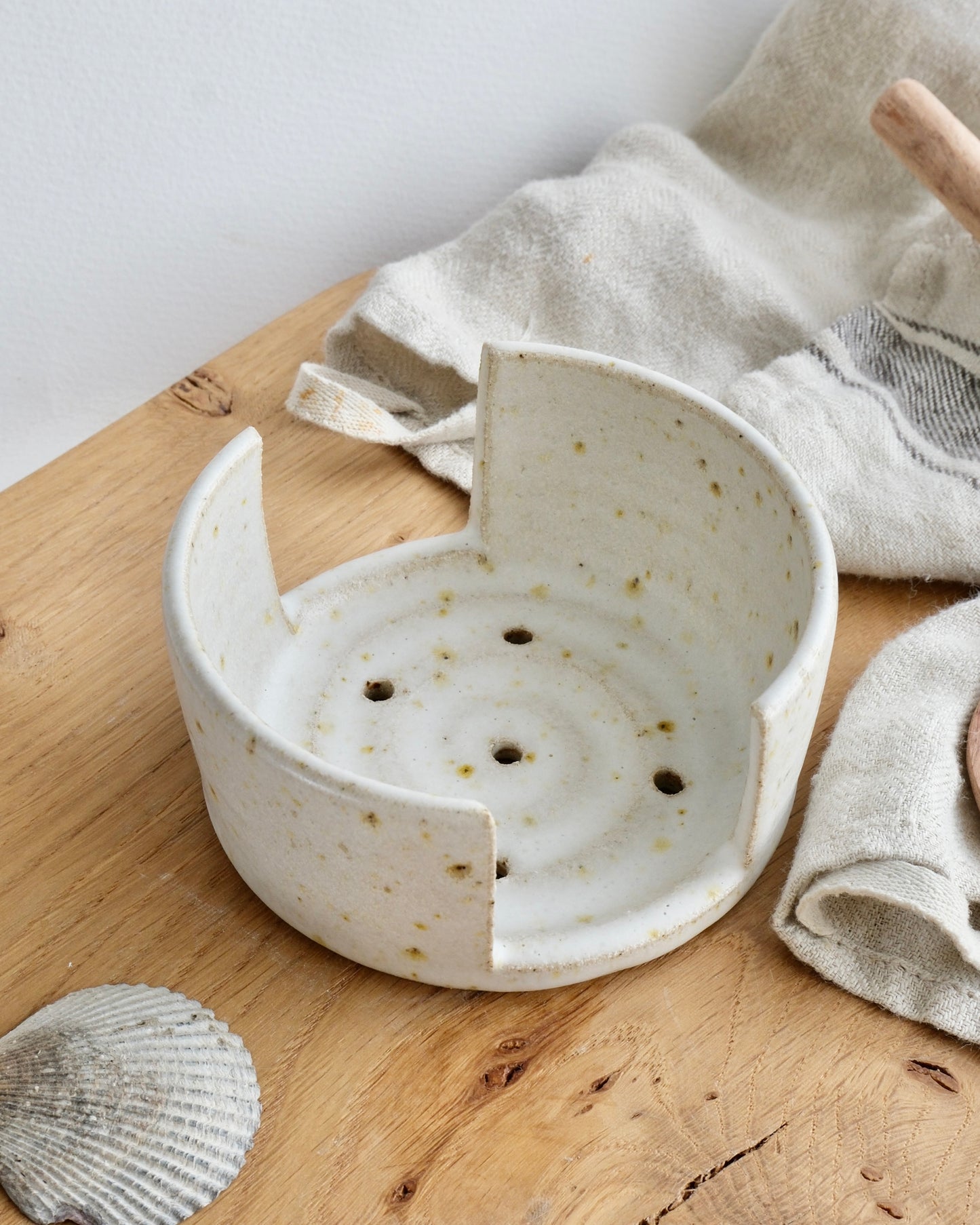 Looking down at a spiral design white speckled sponge dish 