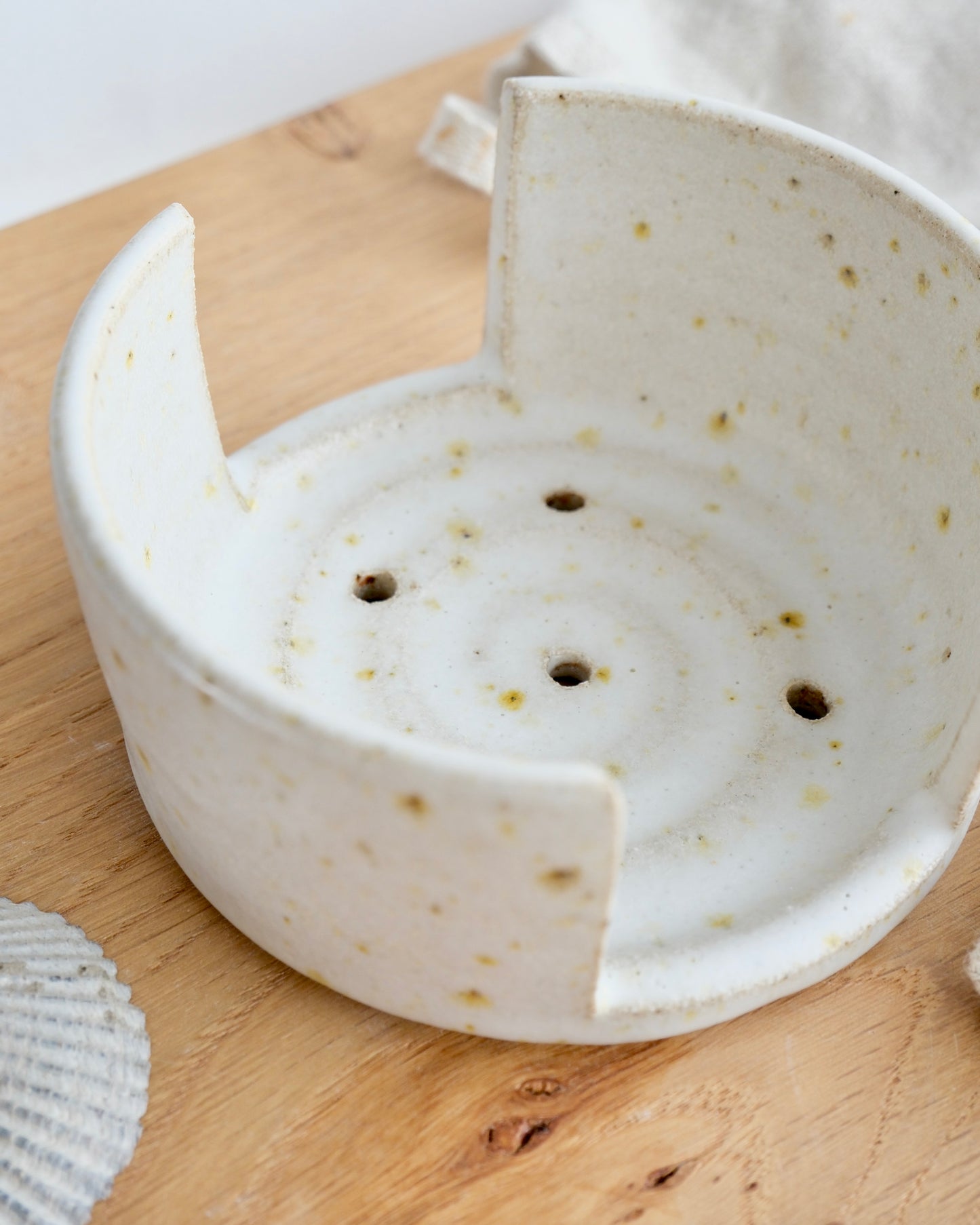 looking down at a white speckled sponge holder dish 