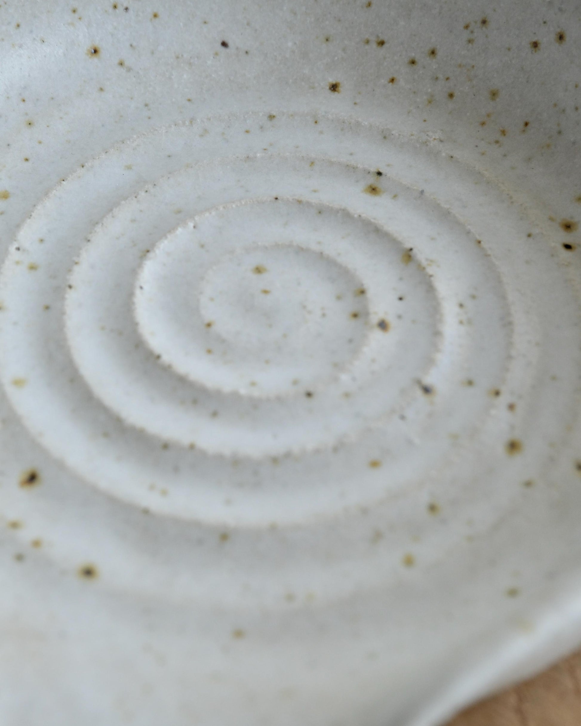 Close-up of a ceramic dish with concentric circle pattern